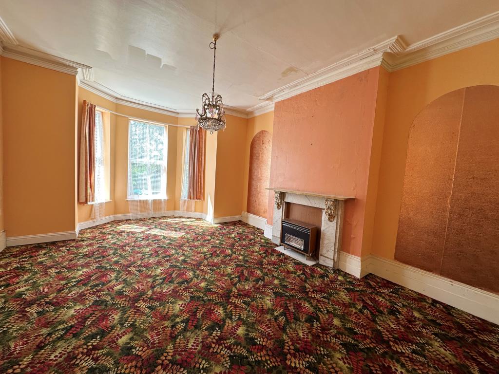 Lot: 129 - EIGHT-BEDROOM SEMI-DETACHED HOUSE FOR REFURBISHMENT - Living Room with Bay Window